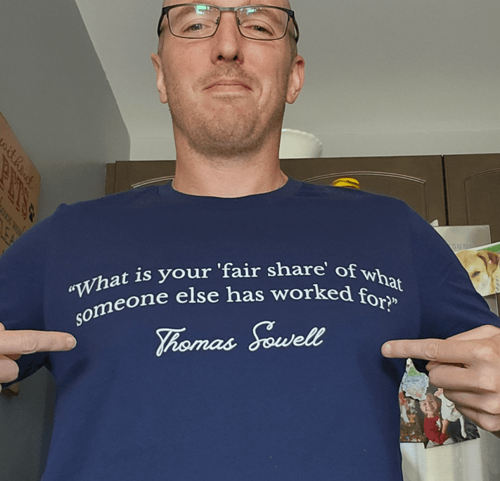 Clay wearing the Fair Share shirt